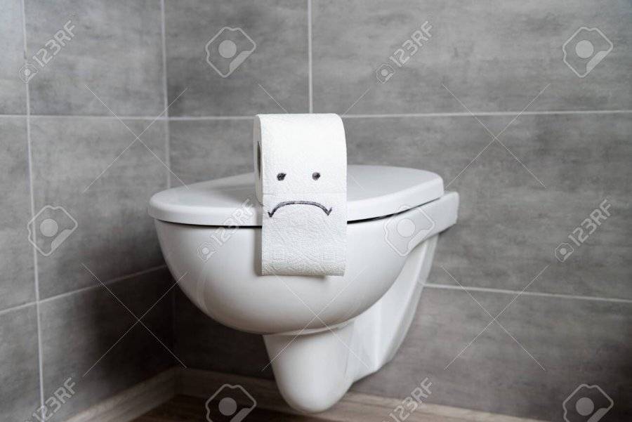 135960801-toilet-paper-with-sad-emoticon-on-toilet-bowl-in-modern-restroom.jpg