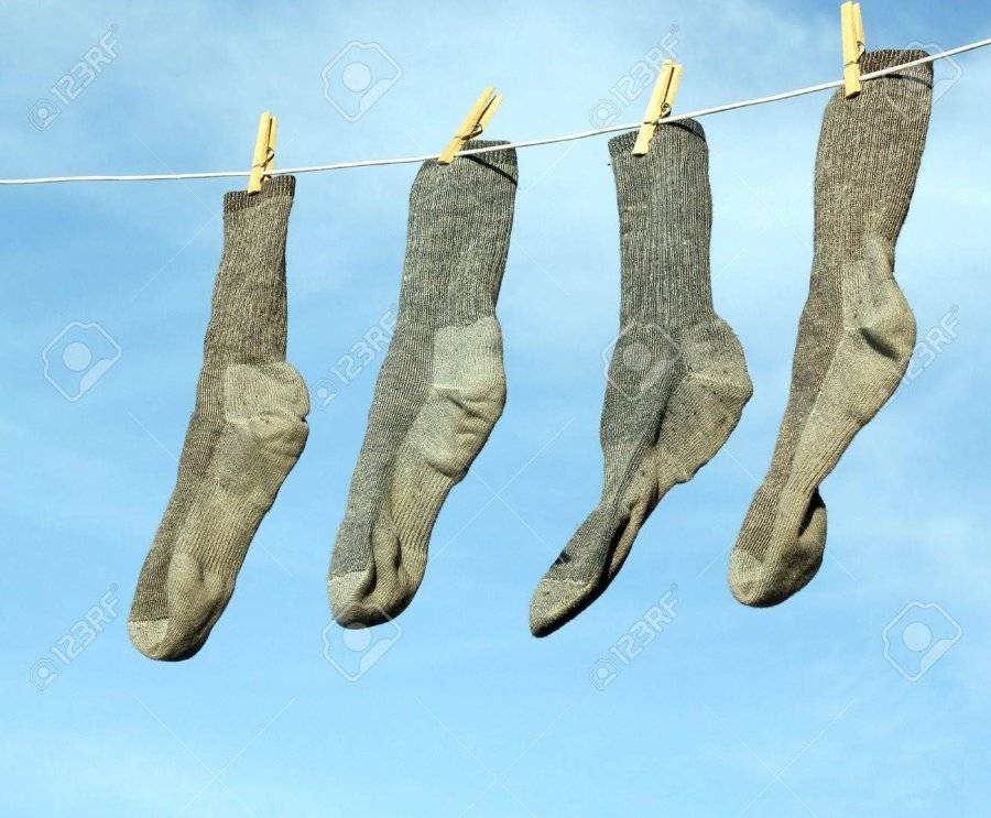 9583136-gray-socks-hanging-on-a-clothesline-with-a-blue-sky-in-the-background.jpg