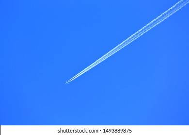 airplane-contrail-flying-blue-sky-260nw-1493889875.jpg