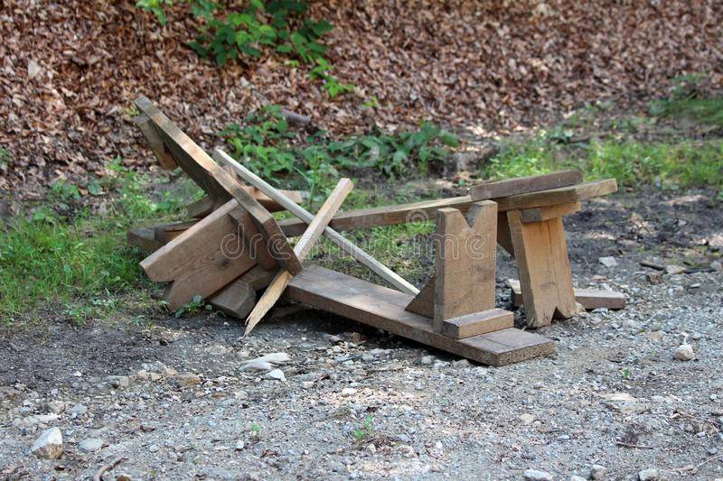 broken-homemade-wooden-benches-left-gravel-road-local-forest-large-storm-floods-154707117.jpg