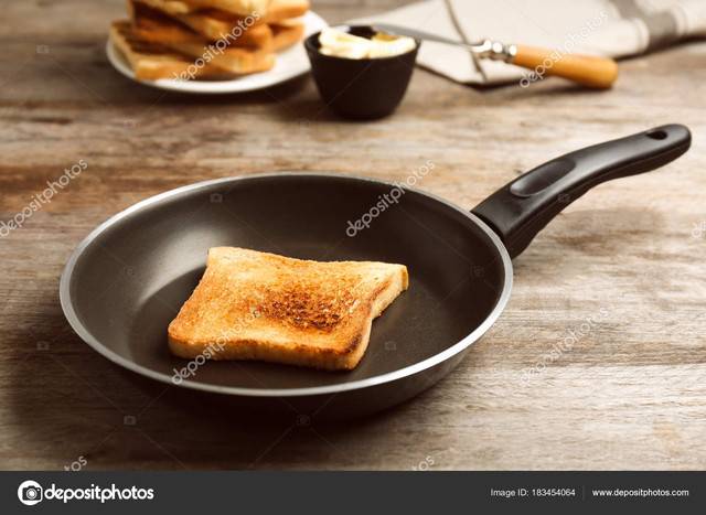 Frying-pan-with-toasted-bread-on-table.jpg