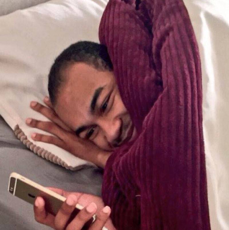 man-looking-at-phone-smiling-laying-in-bed-with-blanket-meme-03acdfa523abff9398f5b5b8c4f19f08.jpg