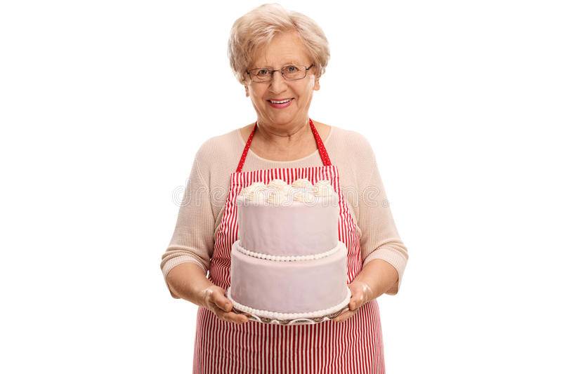 mature-lady-holding-cake-studio-shot-looking-camera-isolated-white-background-71297077.jpg