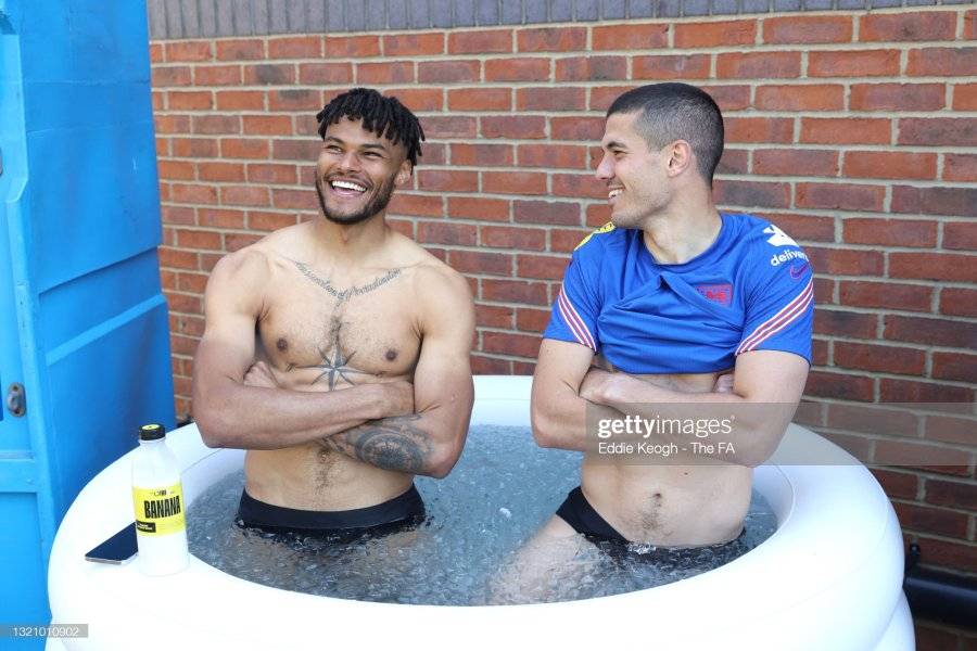 MIDDLESBROUGH-ENGLAND-MAY-31-Tyrone-Mings-and-Conor-Coady-of-England-share-a-laugh-in-an-ice-b...jpg