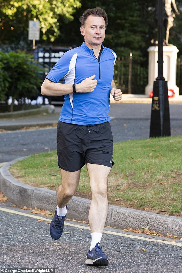 Mr Johnson is expected to emerge victorious from a bruising six-week contest against Jeremy Hunt (pictured out running in London this morning)